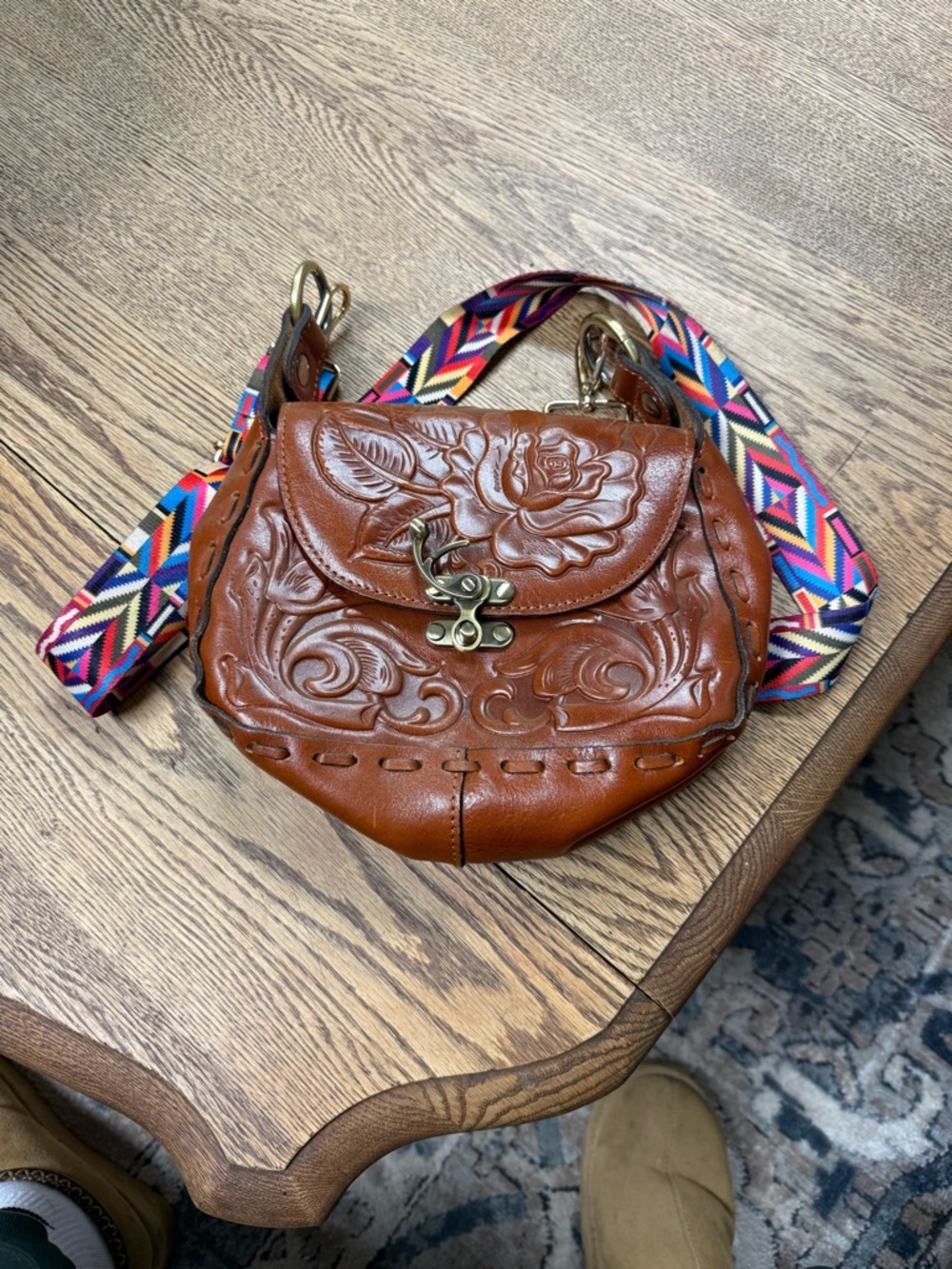 Hand-Tooled Brown Leather Crossbody Bag with Colorful Strap